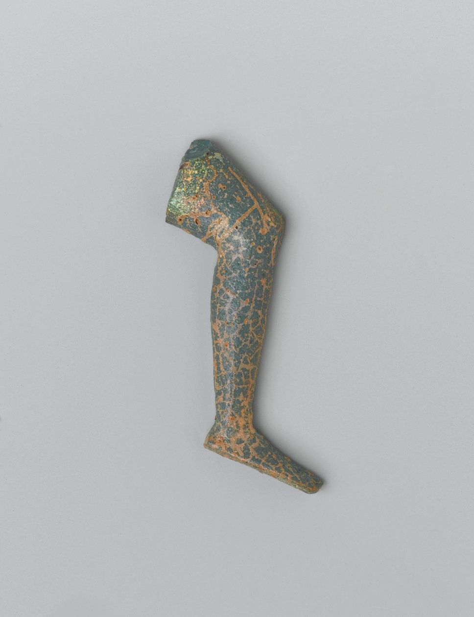 Small blue green opaque glass human leg from an inlay figure by Egyptian