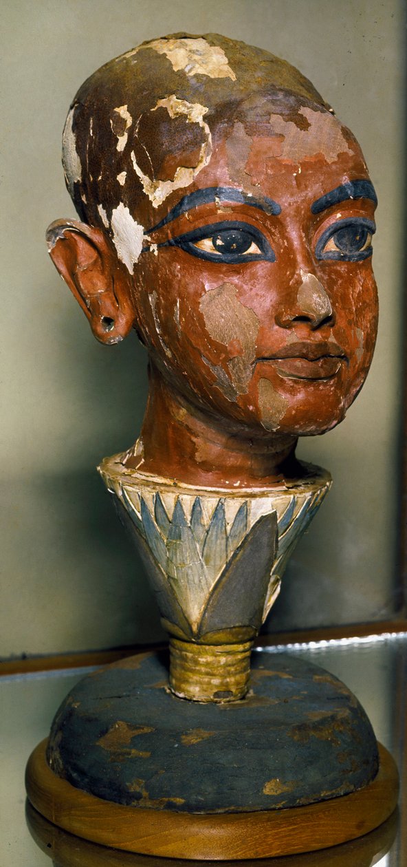 Egyptian Antiquities: Portrait of the Young Pharaoh Tutankhamun Supported by a Lotus Leaf. Painted Wood Carving. From the Treasure of Tutankhamun by Egyptian 18th Dynasty