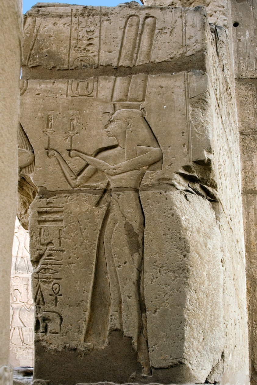 Egyptian antiquity: detail of reliefs depicting the goddess Hathor holding sistrums in her hands, Funeral Temple dedicated to Pharaoh Ramses II, site of Ramasseum in Luxor, Egypt by Egyptian 19th Dynasty