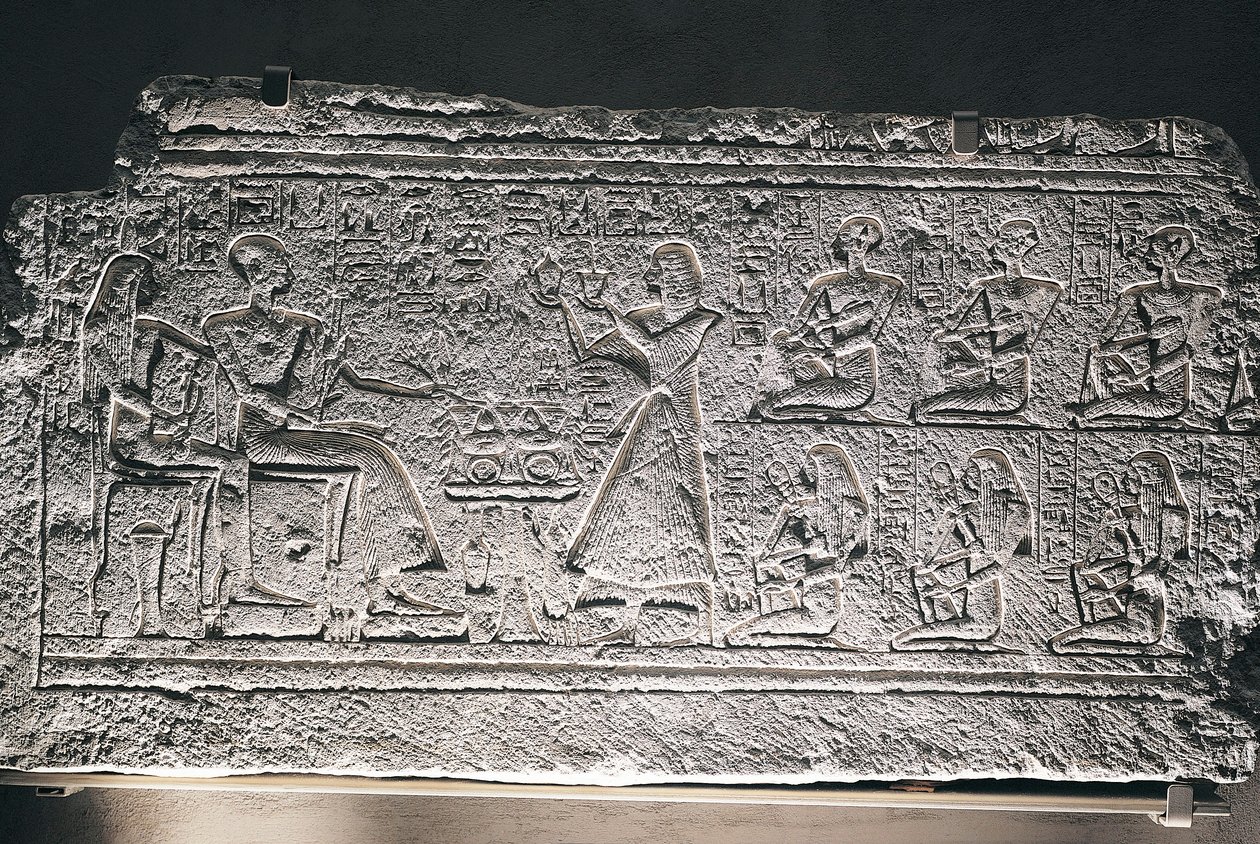 Relief of Ptahotep and Tauseret from Saqqara, the couple receiving offers from their eldest son Amenheb and other children by Egyptian 19th Dynasty