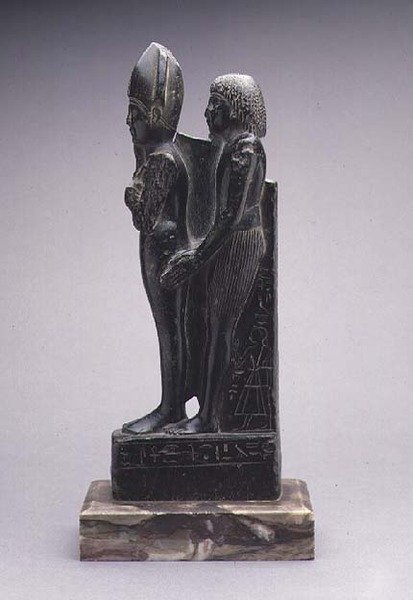 Group of a Man Presenting a Representation of Osiris by Egyptian Egyptian