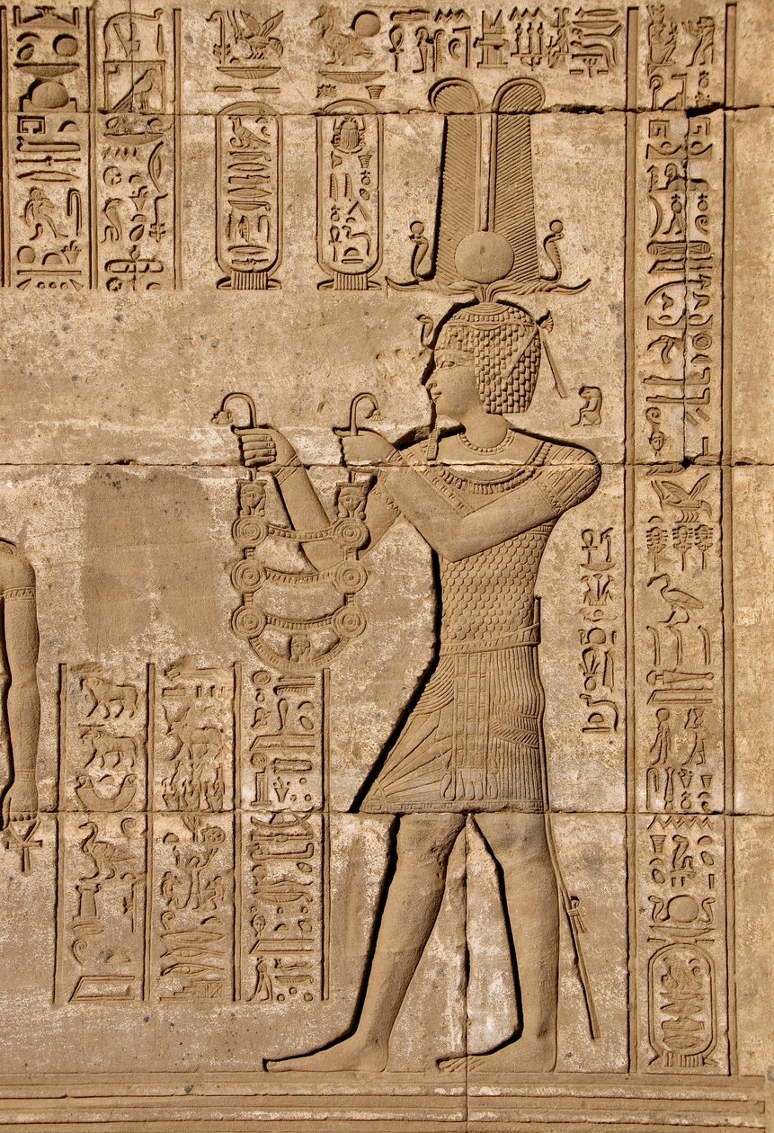 Roman mammisi commemorating the birth of Ihy, son of Isis - Detail of reliefs and hieroglyphs: Emperor Trajan carrying offerings to the goddess Hathor - Temple of Hathor, Denderah, Egypt by Egyptian Ptolemaic Period