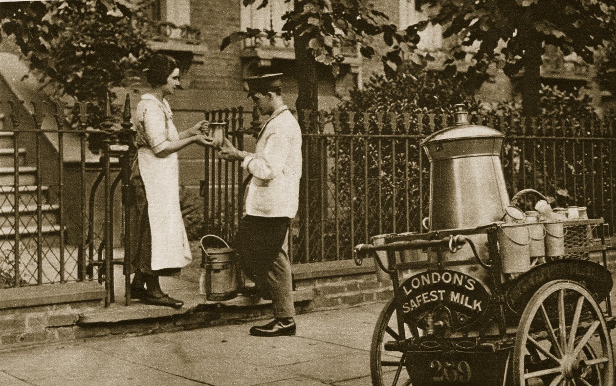 A North London Milkman and his three-wheeled trolley by English Photographer