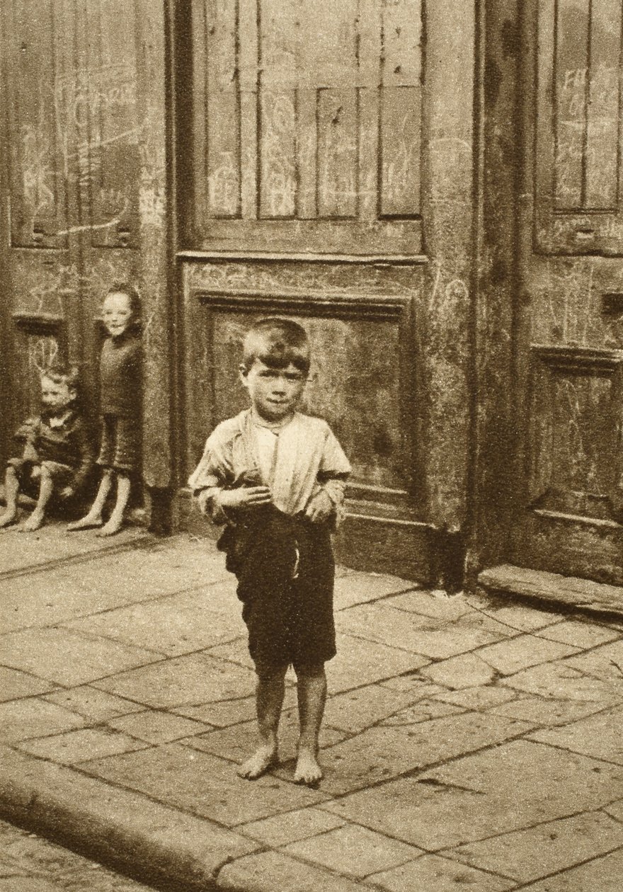 Barefoot child on a London street by English Photographer
