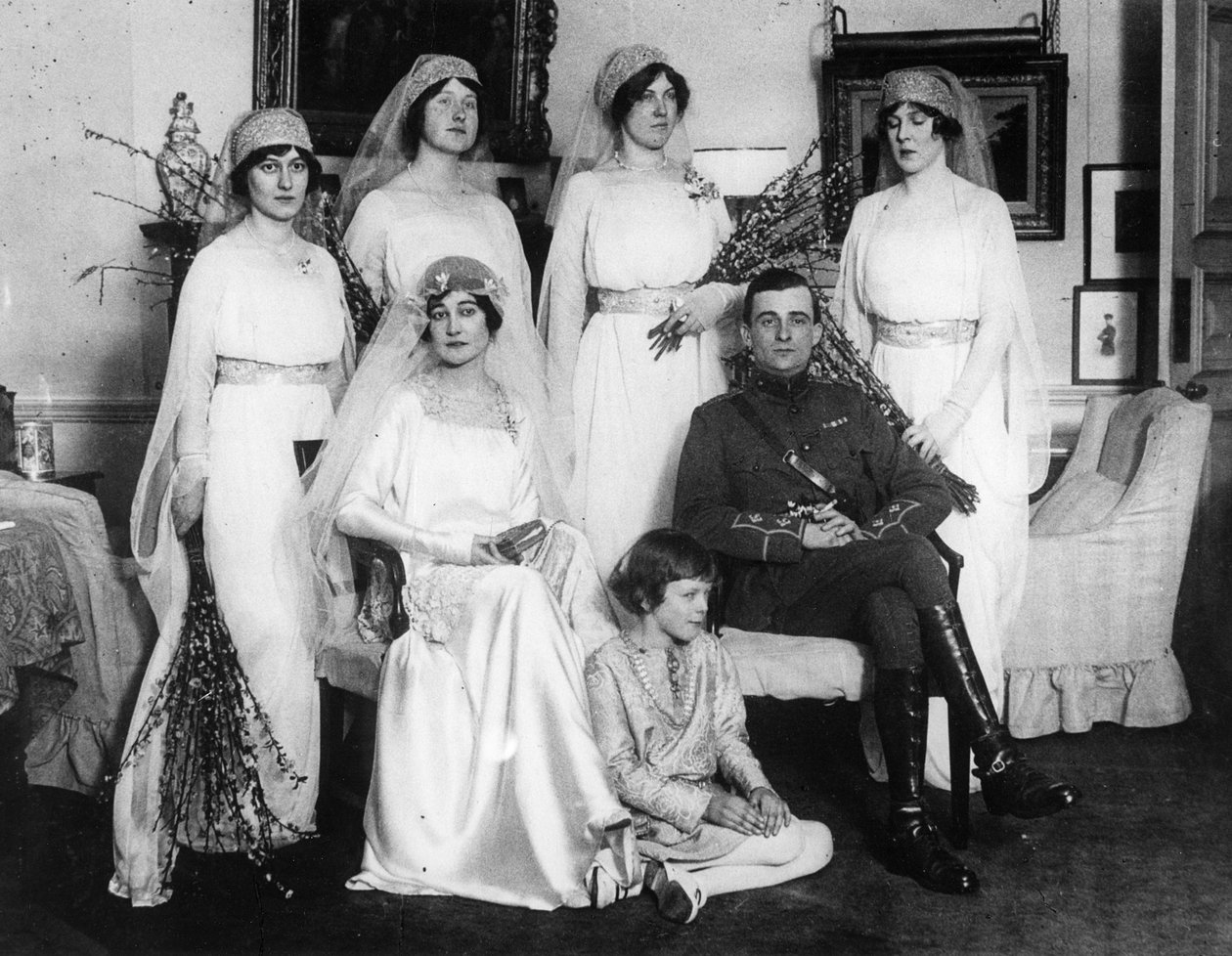 Bride and Bridegroom with Bridesmaids and Train Bearers by English Photographer