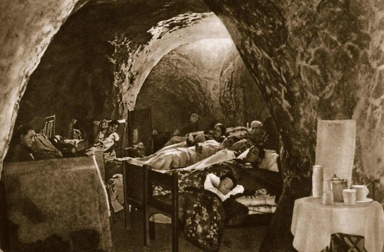 Cave-dwellings on the English coast used as air-raid shelters, 1940 by English Photographer