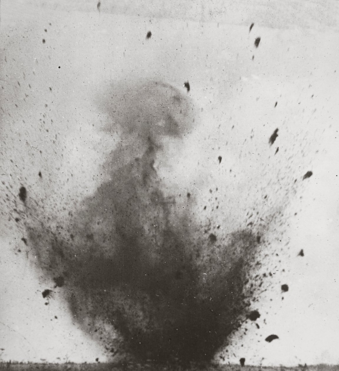 Column of earth from explosion of a British mine under a German position by English Photographer