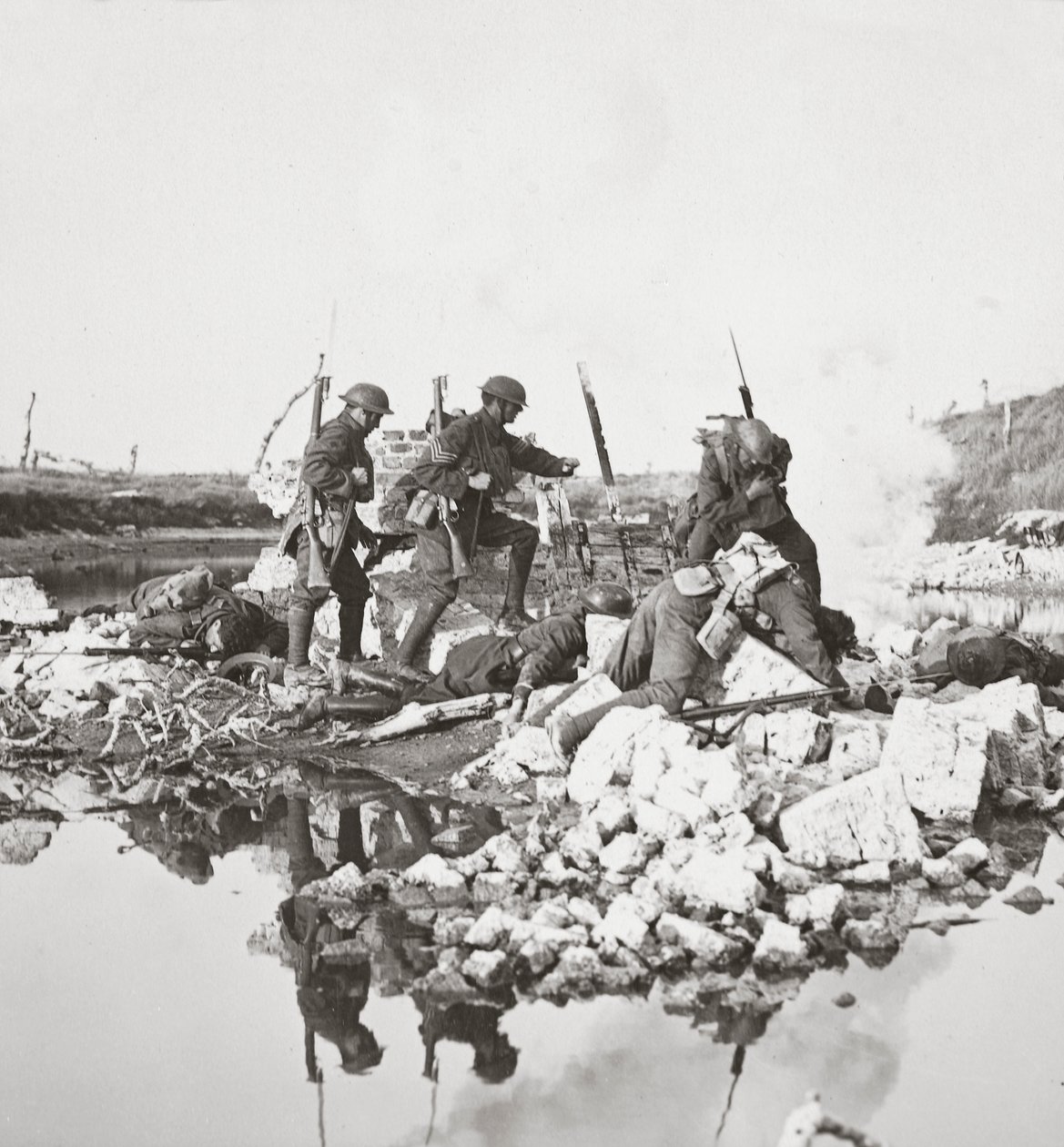 Our fearless men fighting against great odds, mine the bridges and retire across the Crozat Canal, 1918 by English Photographer