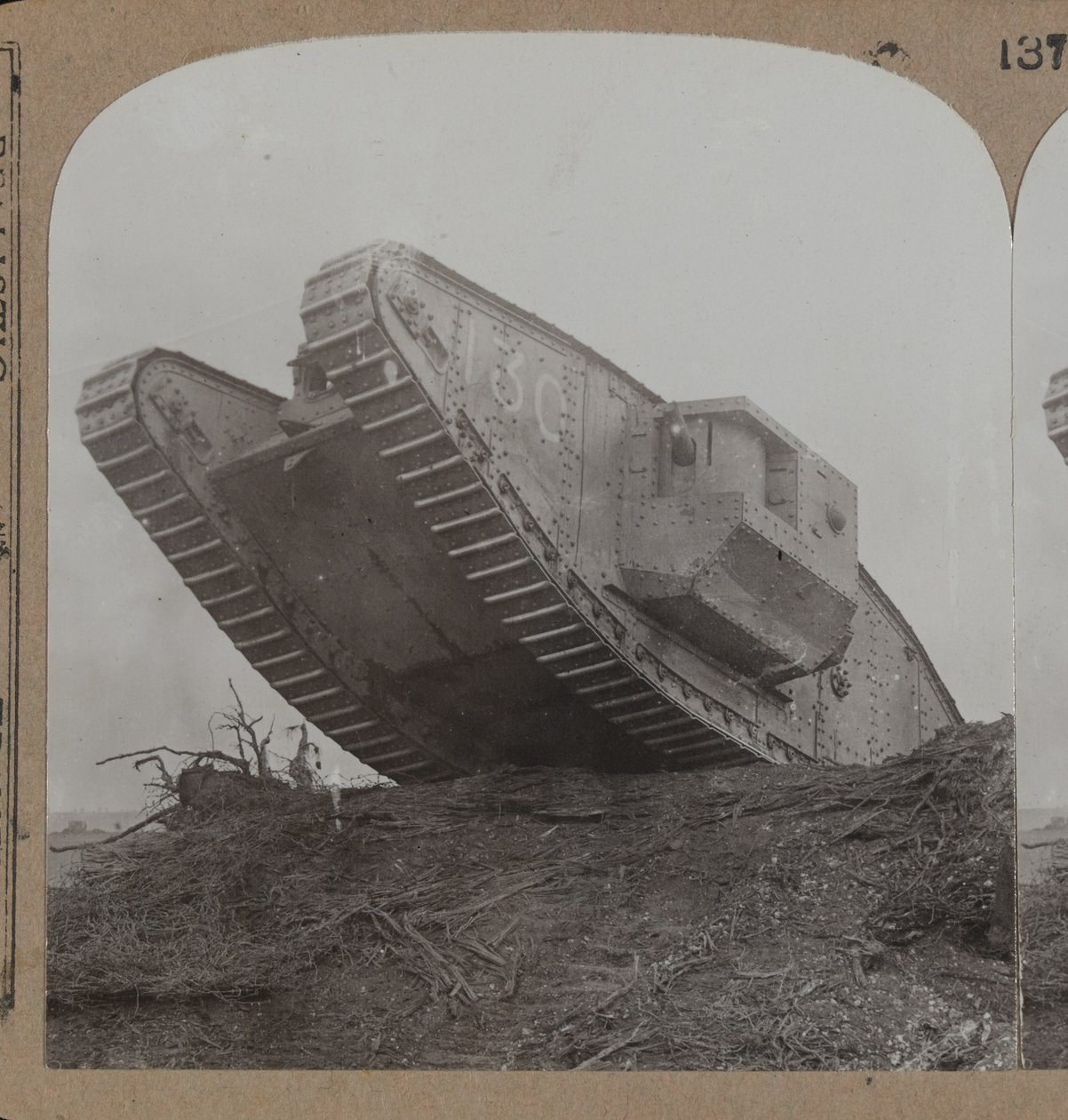 Our monster tanks break down the belts of barbed wire and completely surprise the Hun at Cambrai, 1914-18 by English Photographer