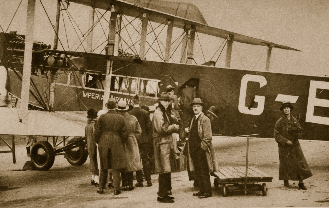 Passengers embarking for Paris by an Imperial Airways craft by English Photographer