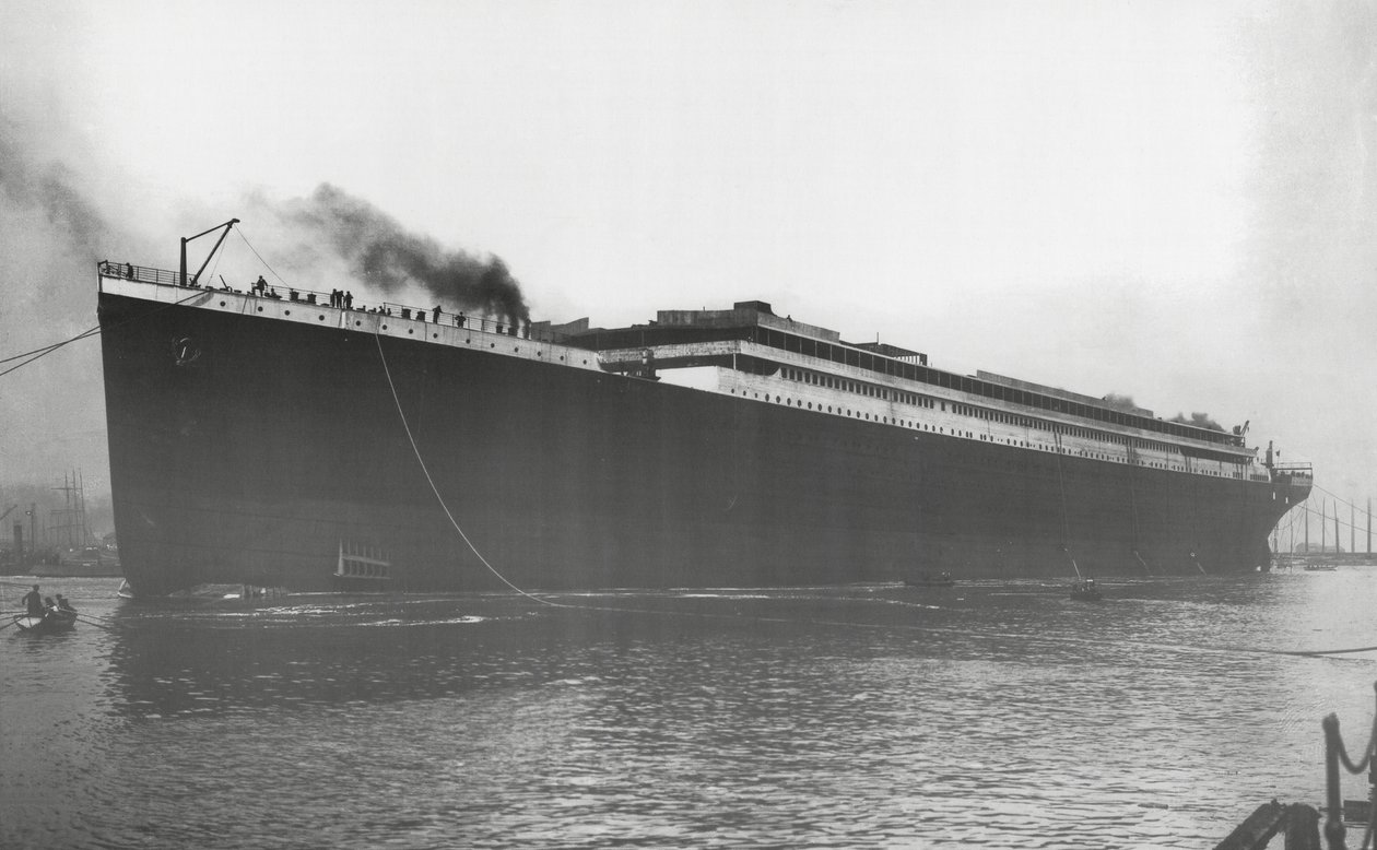 RMS Titanic Launched: Titanic afloat for the first time, but without engines, boilers, machinery and fittings, 31 May 1911 by English Photographer