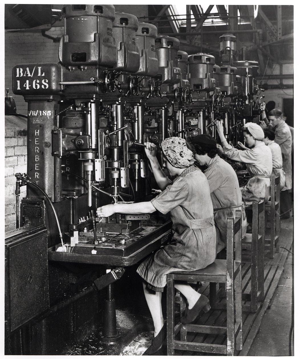 Women at Work, Drilling and Reaming Aircraft Wing Spar Fittings for Blackburn Aircraft, Olympia Works, Leeds, c.1939-45 by English Photographer
