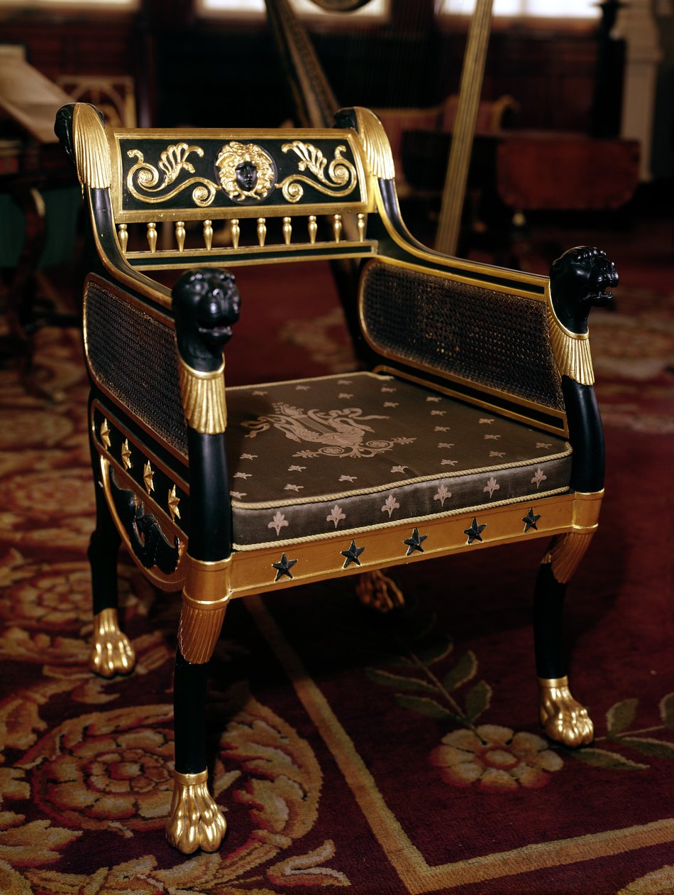 Carved armchair with gilt details by English School