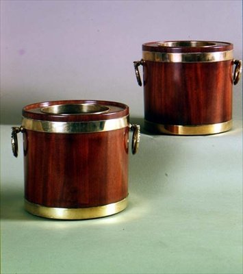 Pair of circular wine coolers with brass handles by English School