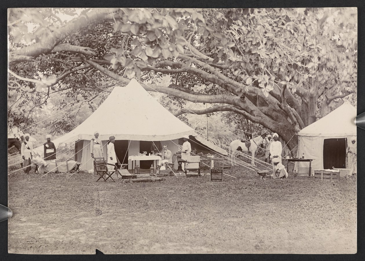 J.J. Cotton in topi and tent (b/w photo) by English Photographer