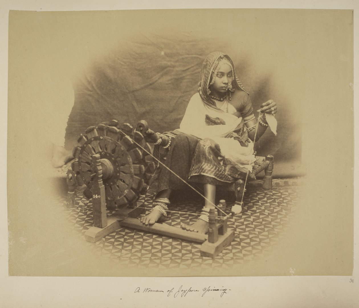 A woman of Jeypore spinning, c.1890 by English Photographer