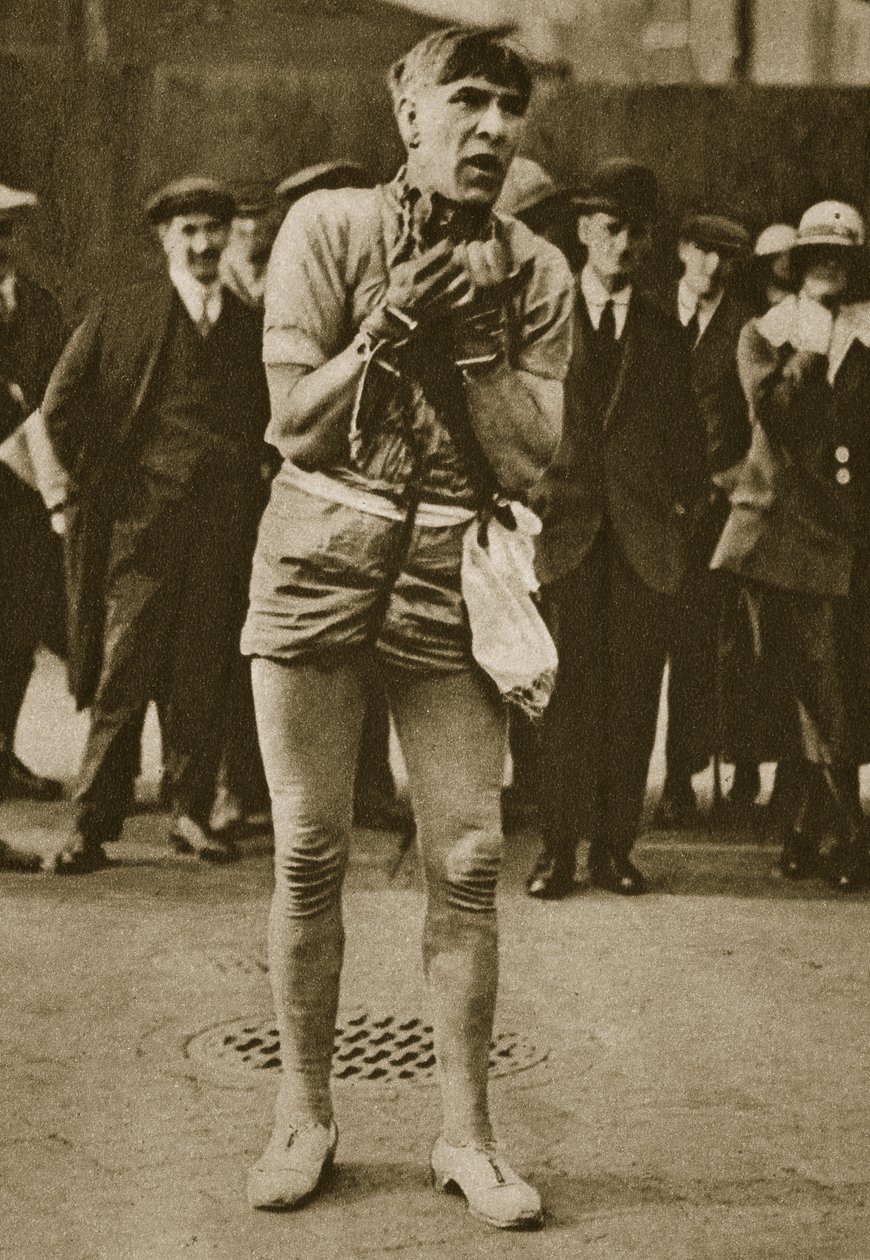 An actor dressed up as Houdini outside a theatre pit-door by English Photographer