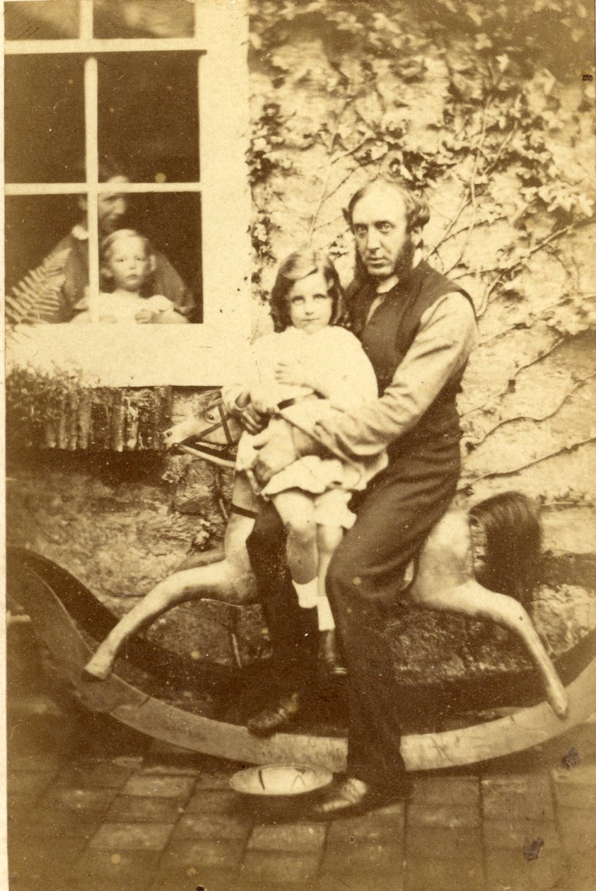Father and Daughter Seated on a Rocking Horse with Brother and Mother Looking Through Window, 1860s by English Photographer