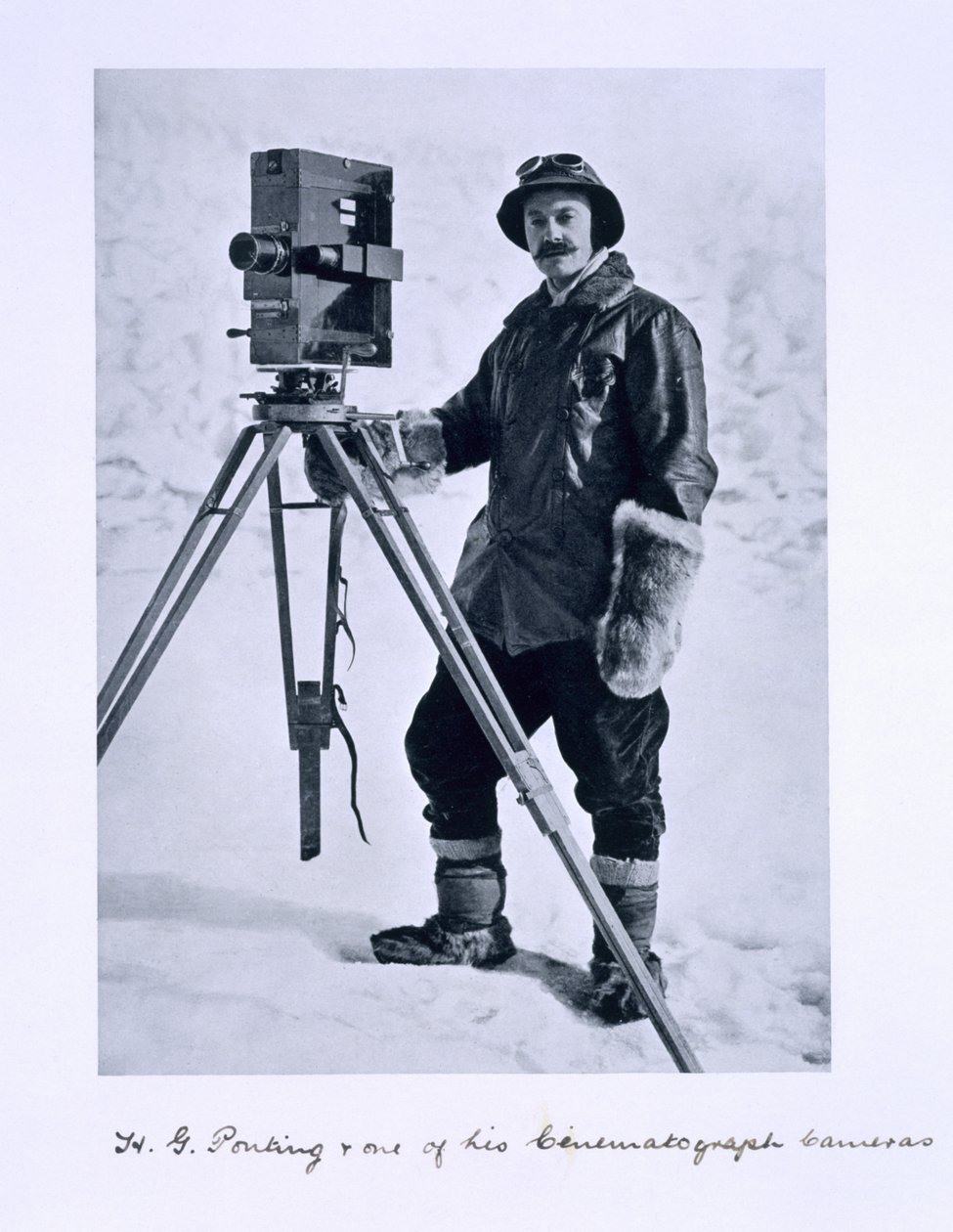 Herbert Ponting with a cinematographic camera on the Terra Nova expedition to the South Pole lead by Captain Scott, 1910-12 by English Photographer