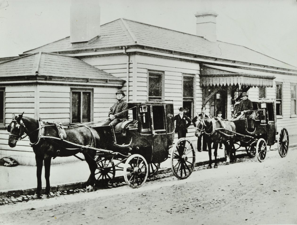 Horse-drawn cabs at Westbourne Park Station by English Photographer