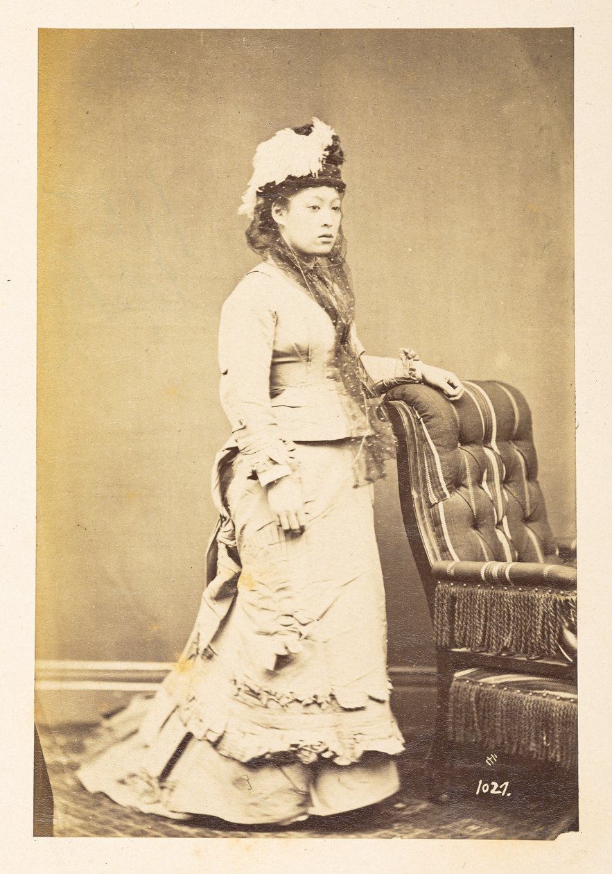 Japanese woman in European dress, Full-length standing studio portrait by English Photographer
