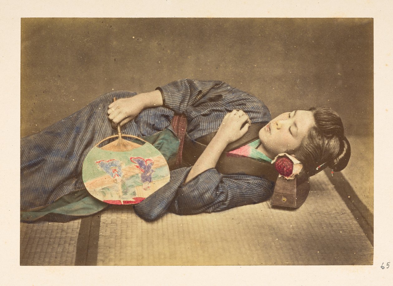 Japanese woman sleeping, Three-quarter length studio portrait by English Photographer