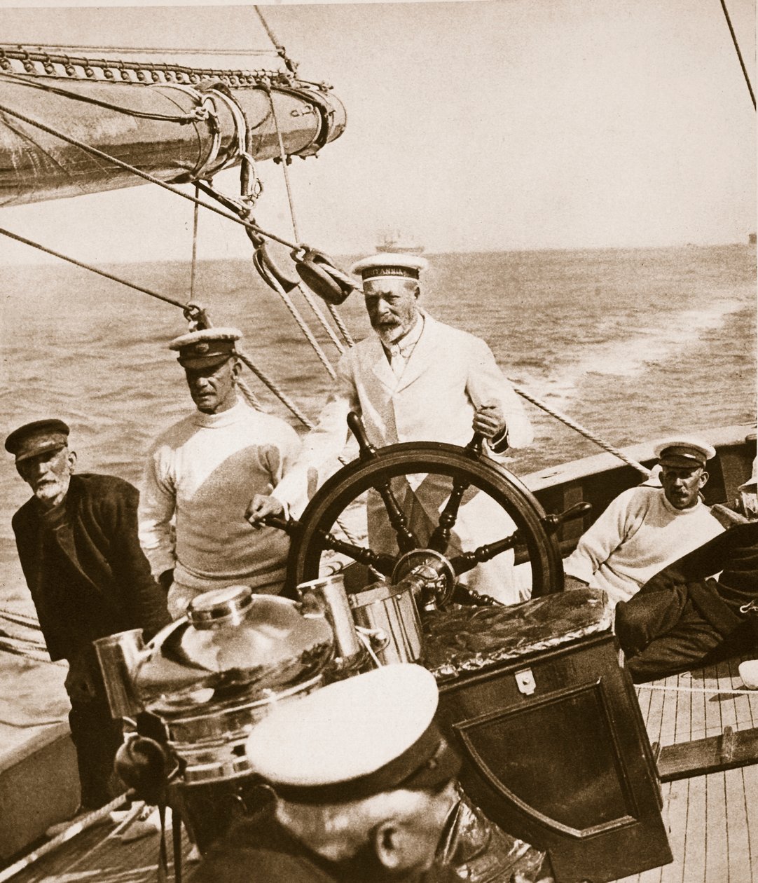 King George at the Helm of His Yacht Britannia, 1920s-30s by English Photographer