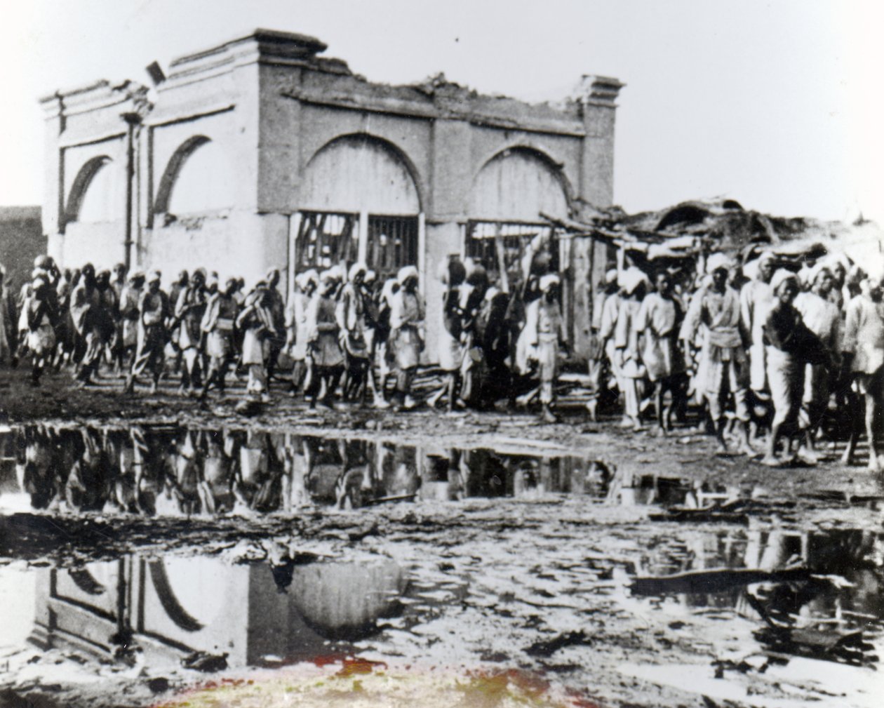 Prisoners passing the Mihrab, the Khalifa