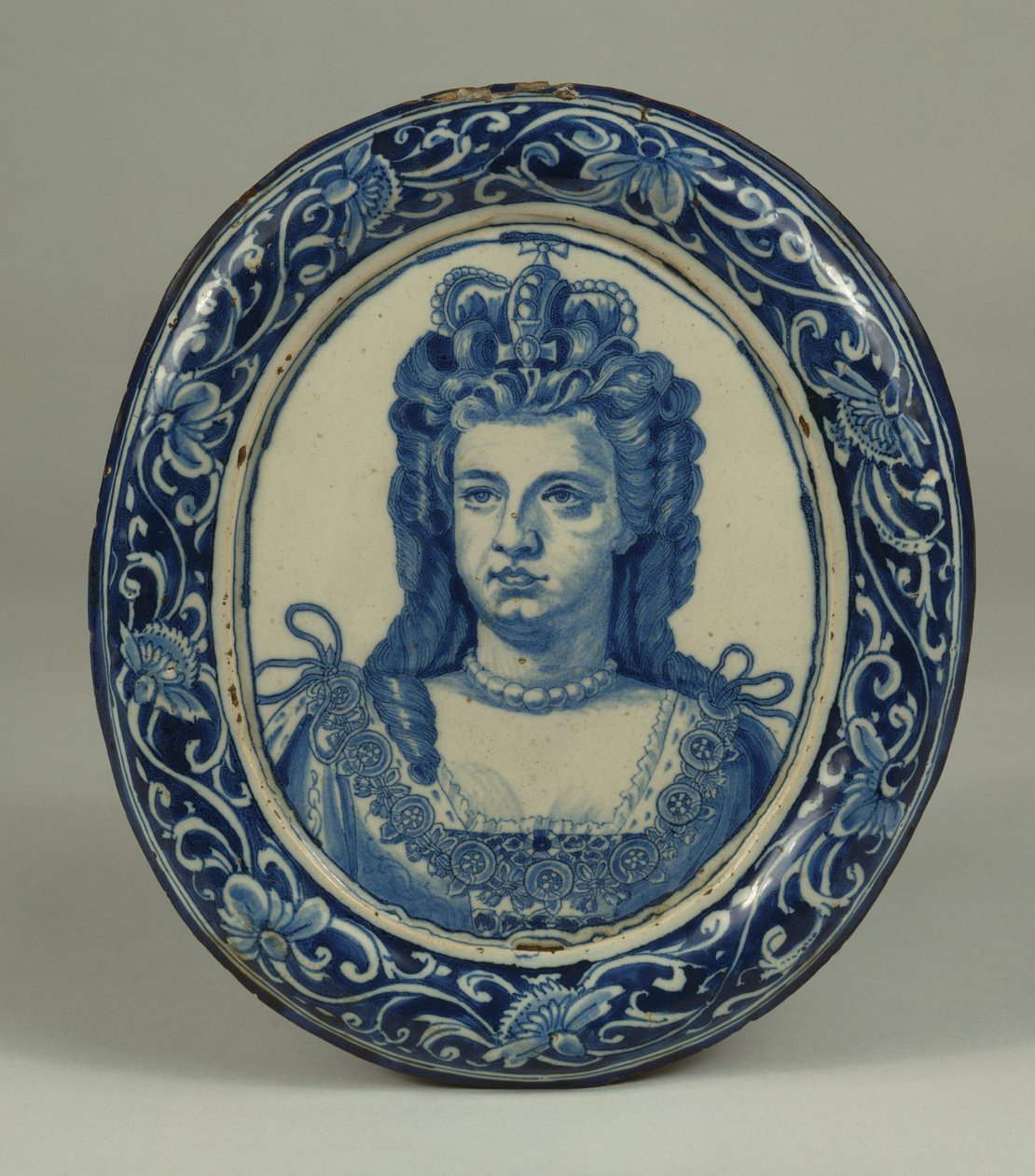A Delft Blue and White Oval Royal Portrait Plaque of Queen Anne, Probably London, c.1705 by English School
