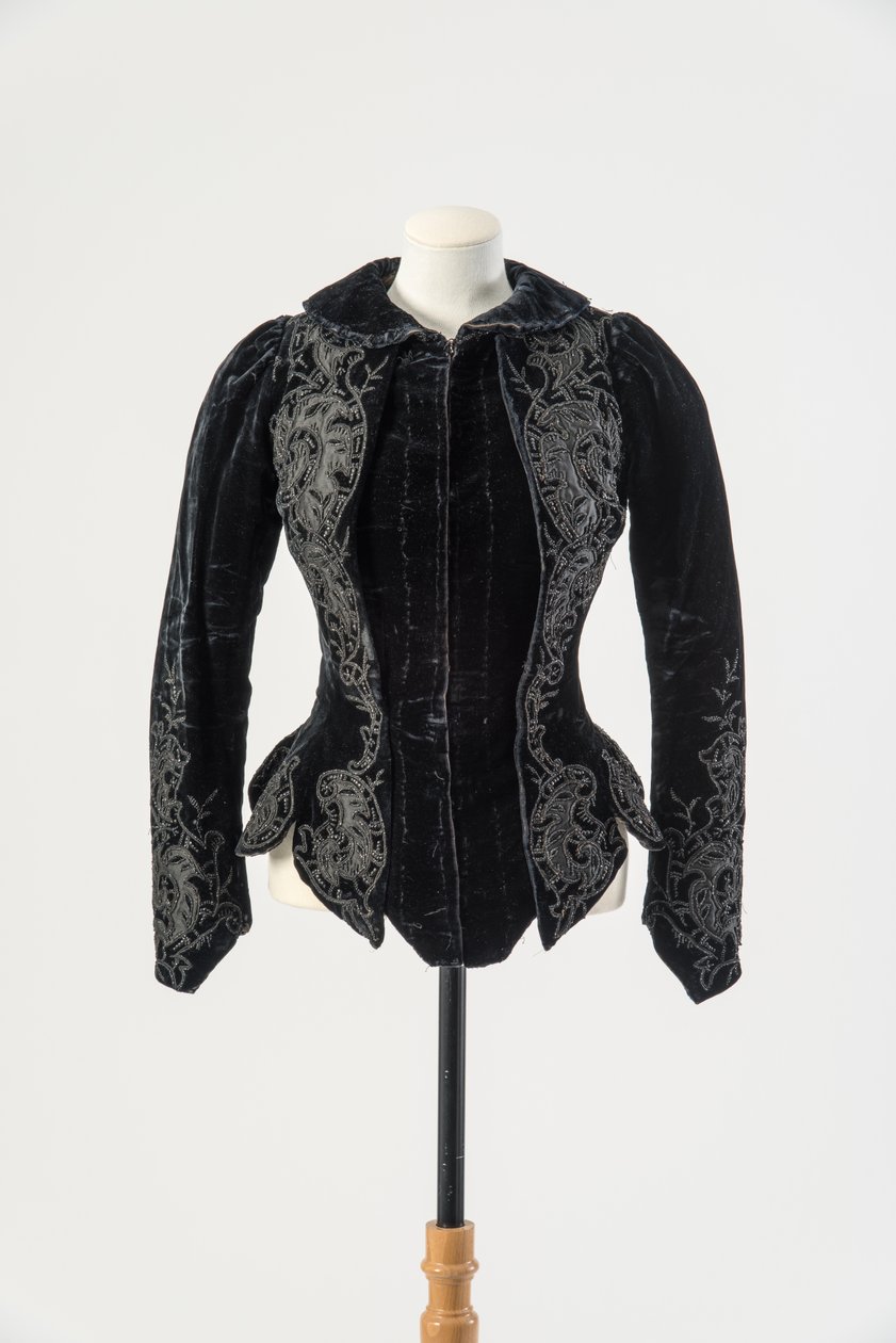 Black velvet jacket embroidered with applied black silk and metal beads, late 1890s by English School