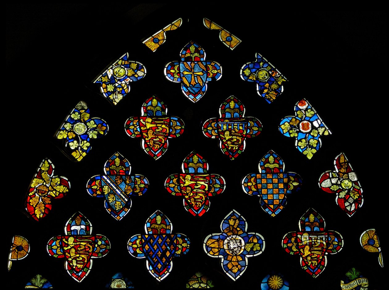 The East window tracery lights heraldic glass showing the local leading families
