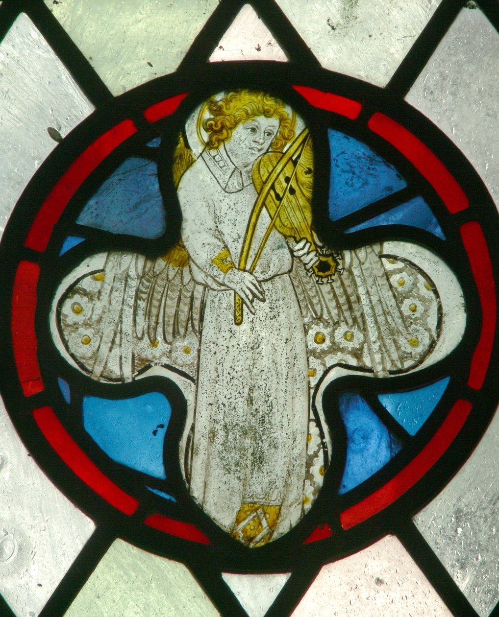 Window depicting a musician angel with a rebec by English School
