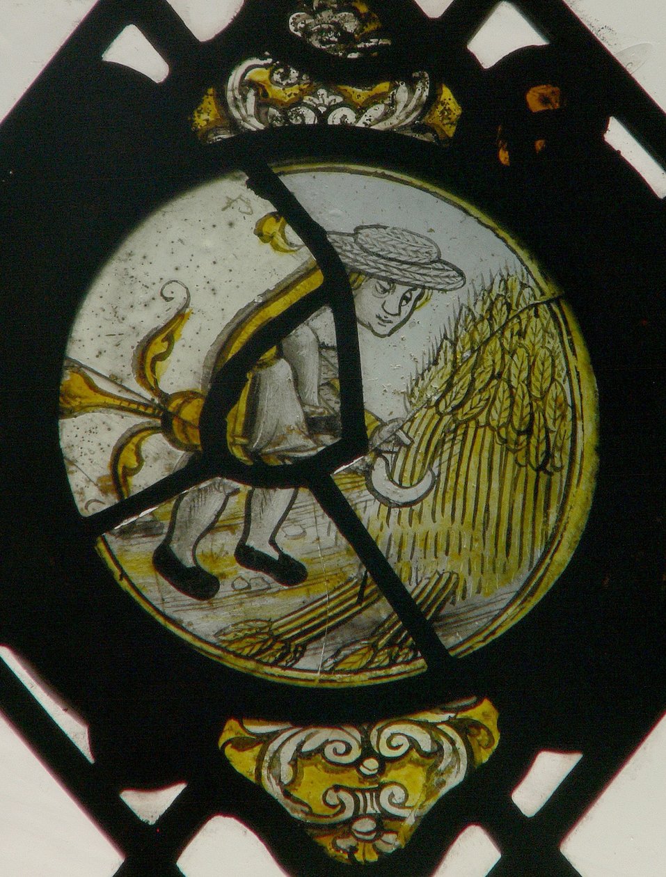 Window depicting the Labours of the Months: August by English School