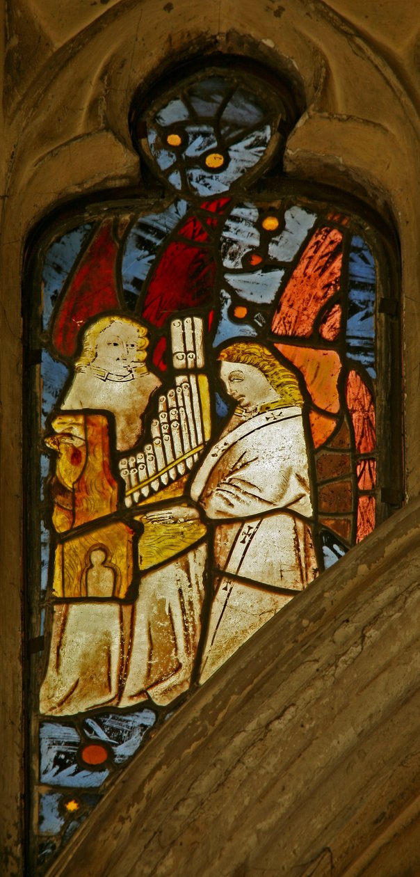 Window depicting musician angels, one with a portative organ by English School