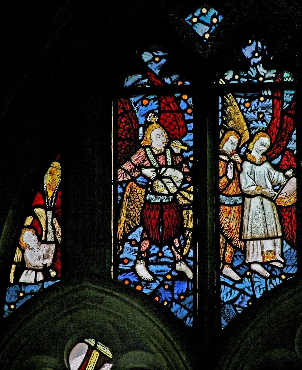Window depicting an angel censing; musician angels with pipe and tabor by English School