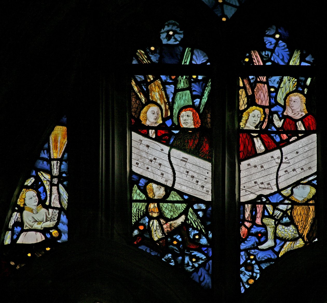 Window depicting the angelic choir singing; angel censing by English School