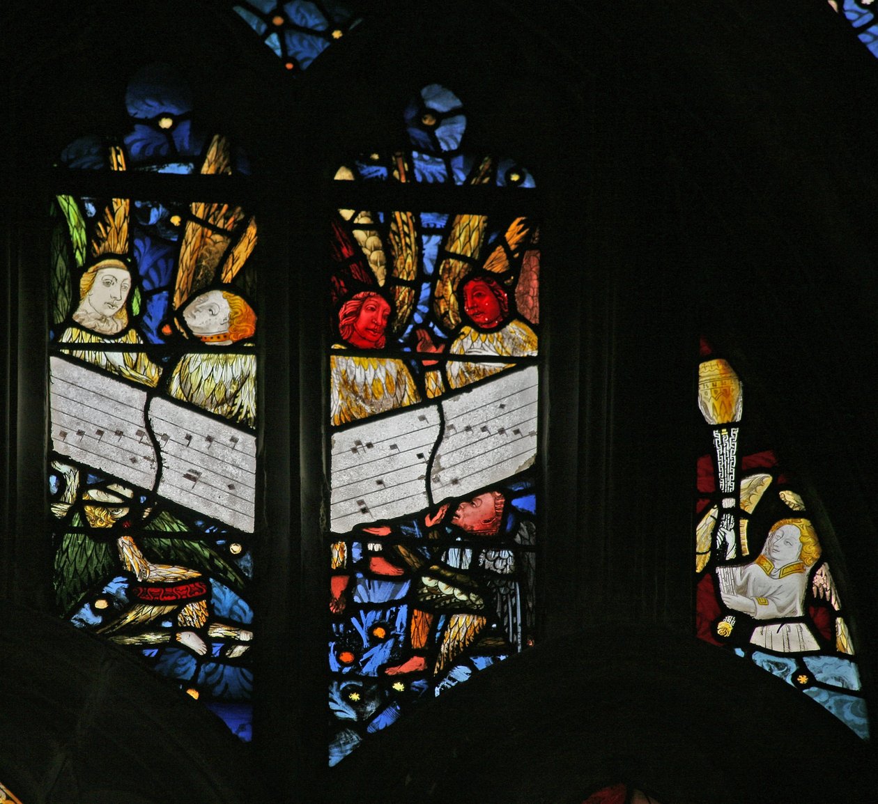 Window depicting the angelic choir singing; angel censing by English School