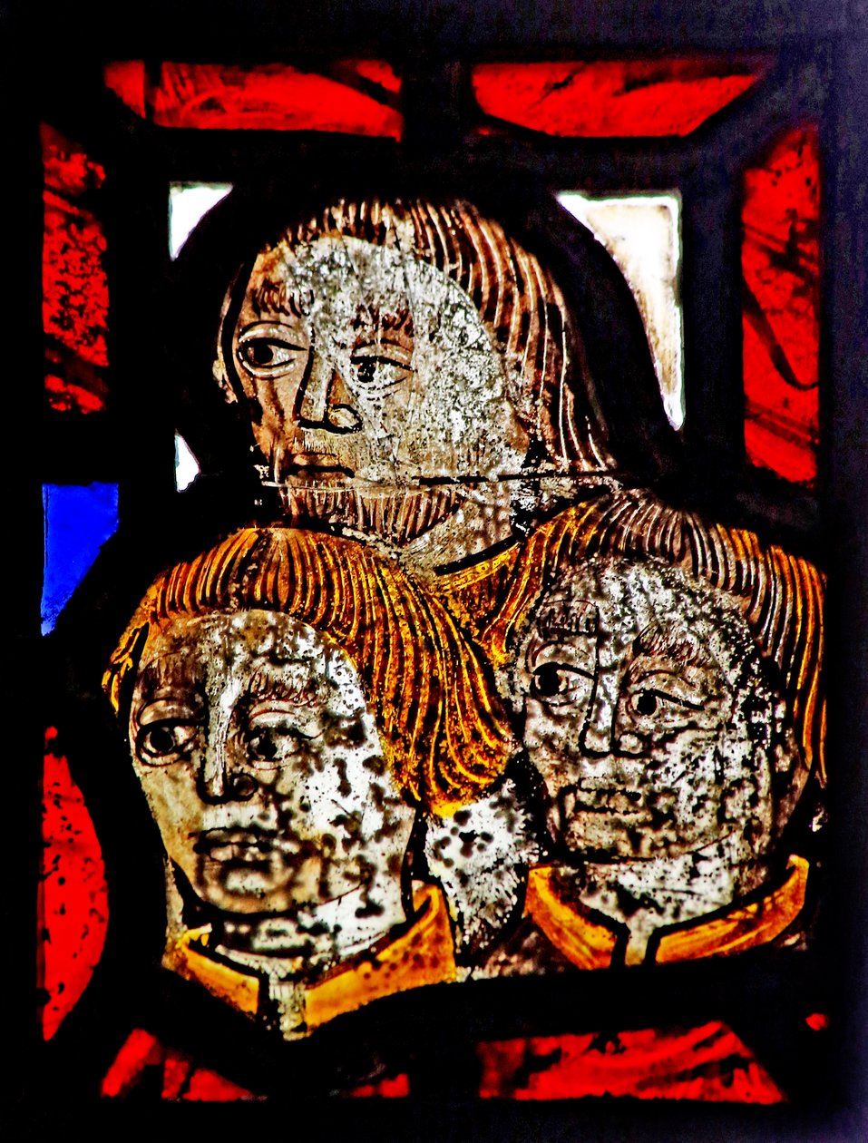 Window s6 depicting a reset fragment with three heads by English School