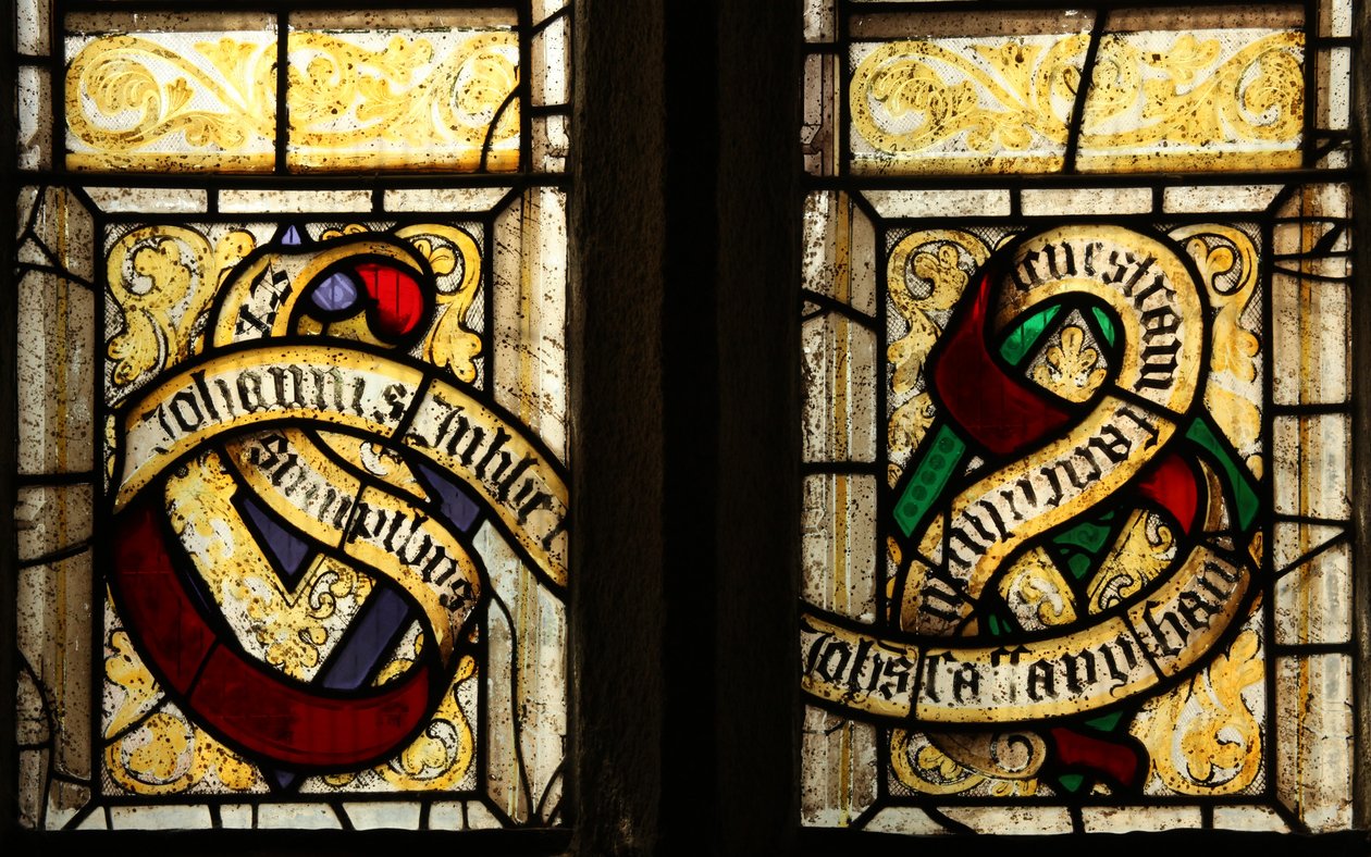 Window depicting Tubbe family motto by English School
