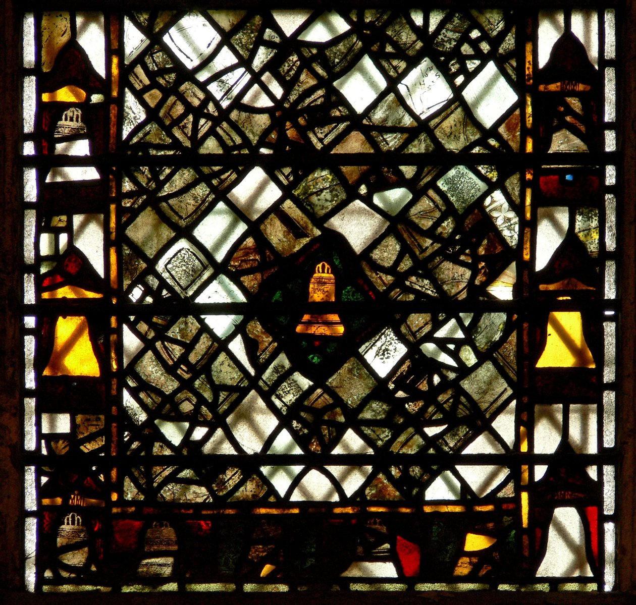 Window w41 depicting a bell and grisaille by English School
