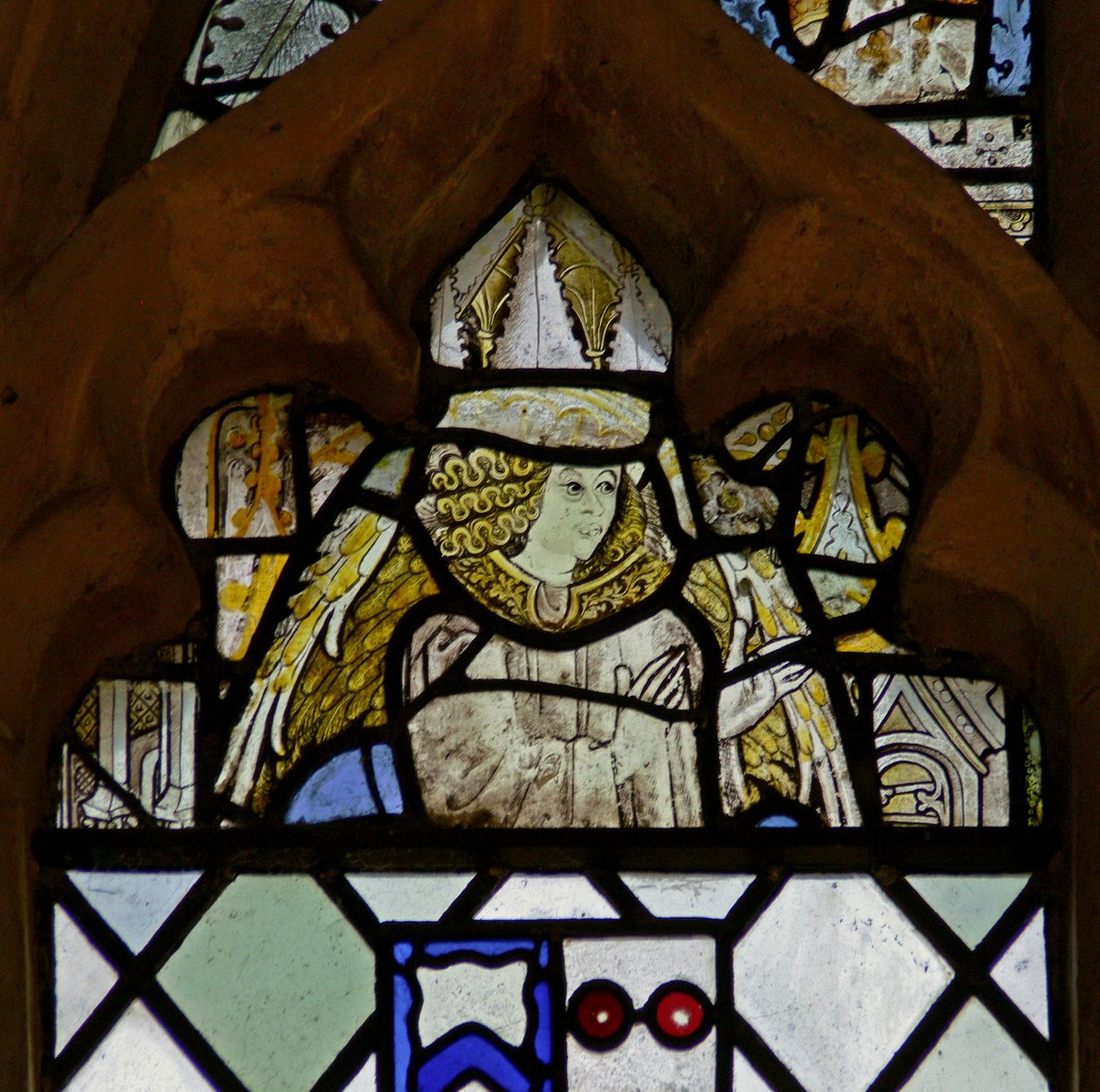 Window w7 depicting an angel by English School