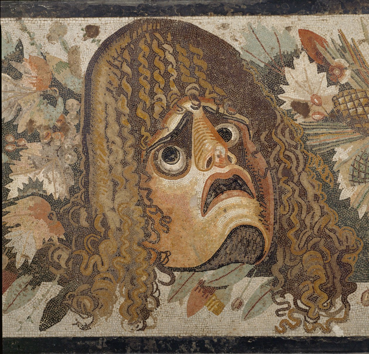 Festoon with masks, leaves, and fruit by Erich Lessing