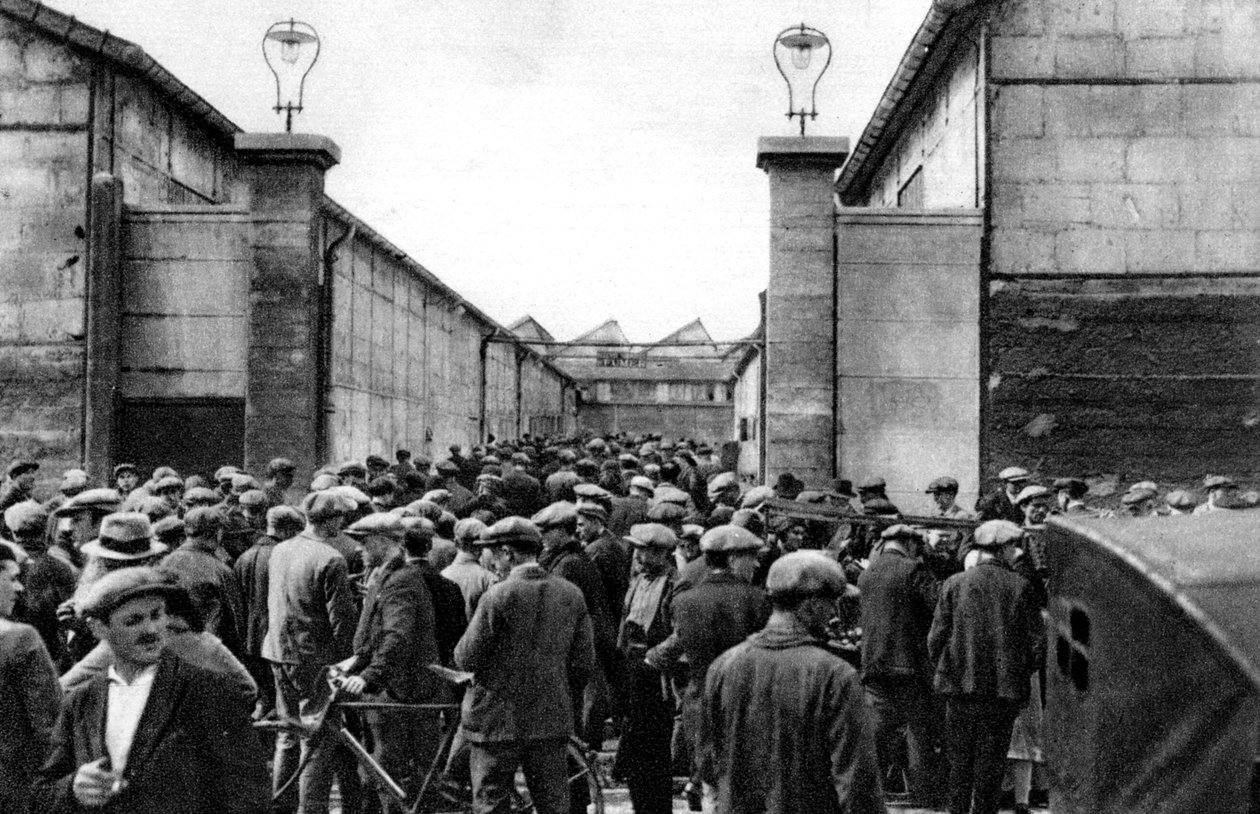 Workers at the entrance of a Billancourt factory, Paris by Ernest Flammarion