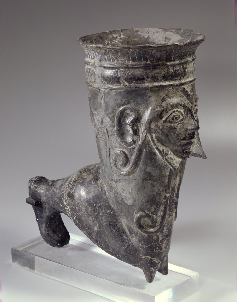 Bucchero Vessel in the Form of a Leg with Sculpted Face, Etruscan Period, 2nd Half of 6th Century BC by Etruscan