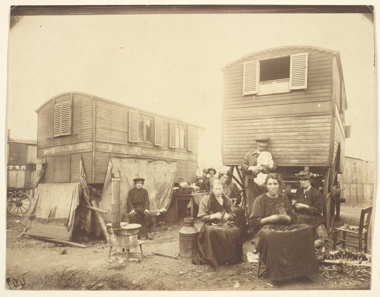 Roma People Seated Outside of Their Wagons by Eugène Atget