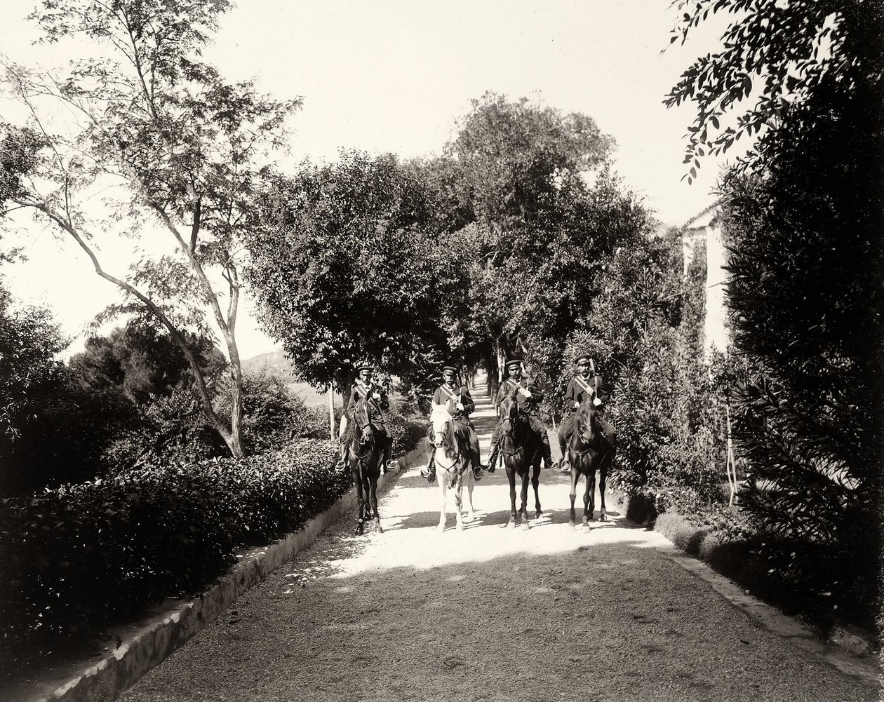 A group of uniformed men on horseback at the farm Lo Zucco, Sicily by Eugenio Interguglielmi
