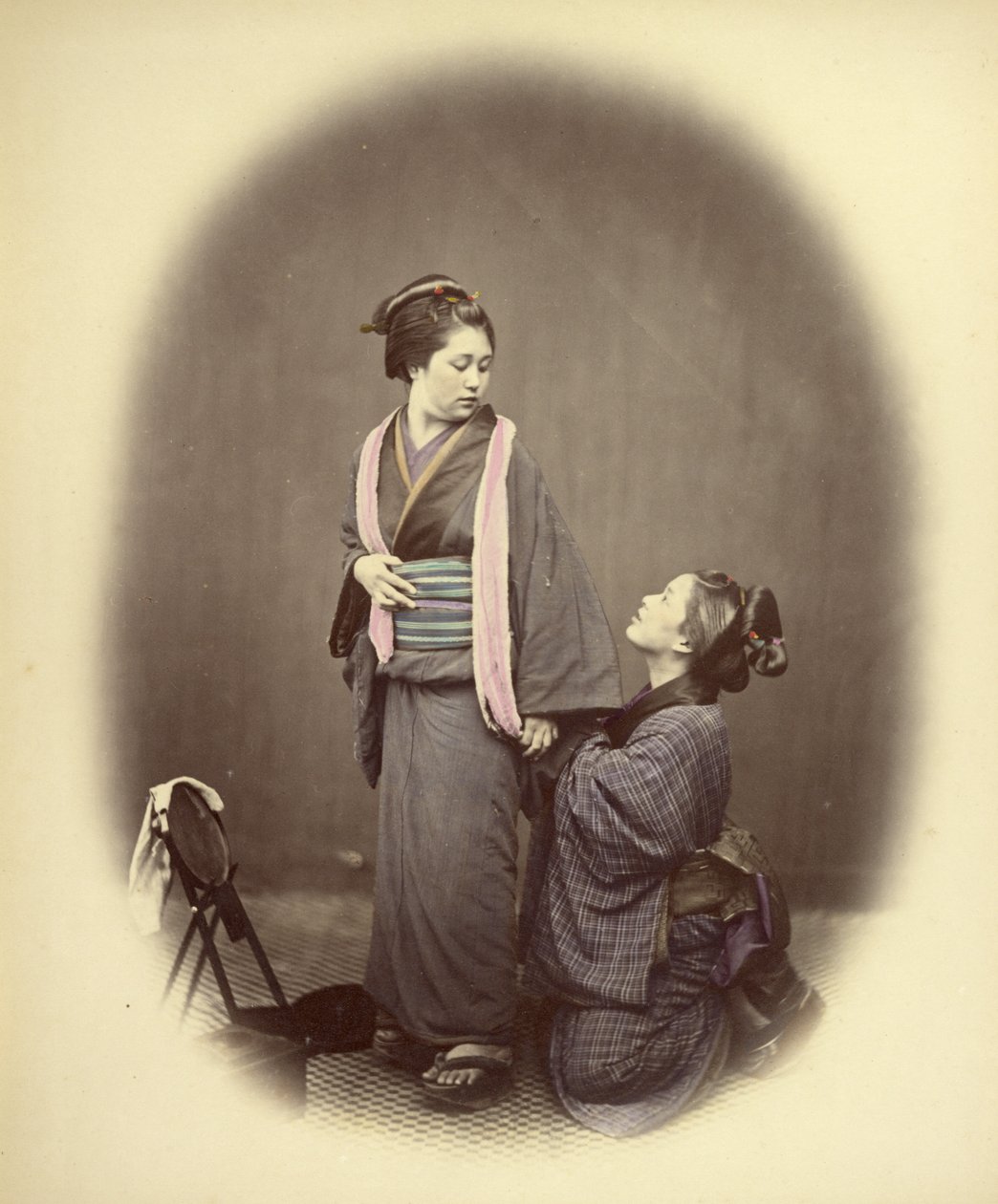 Putting on the Obi, or Girdle by Felice Beato