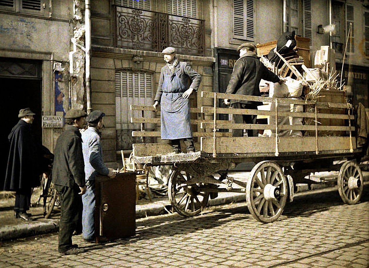 Four workers loading personal belongings onto a cart, Reims, Marne, France, 1917 by Fernand Cuville