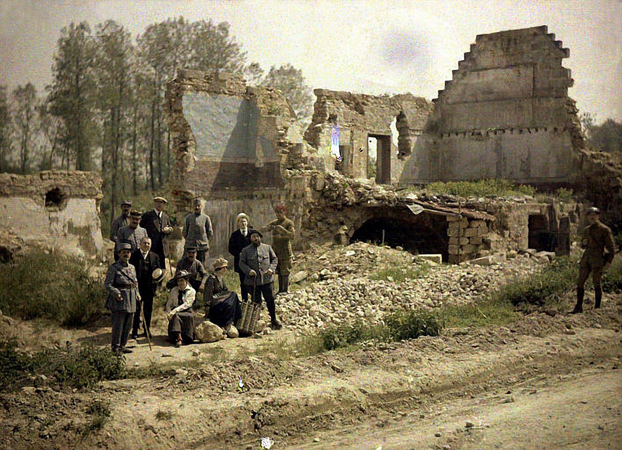 French soldiers and actors of the front theatre pose in the ruins, Vauxrezis, Aisne, France, 1917 by Fernand Cuville