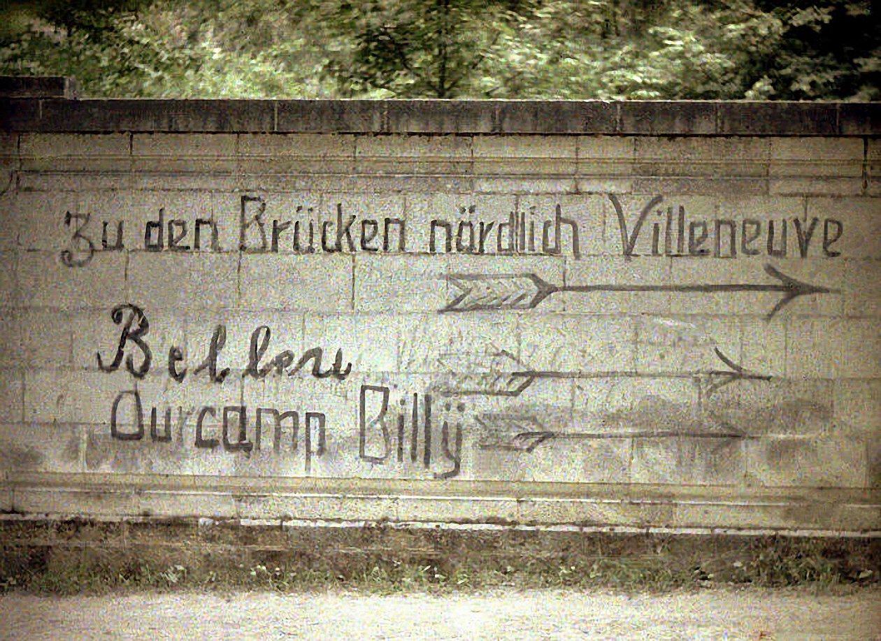 German and English inscriptions on a wall, Soissons, Aisne, France by Fernand Cuville